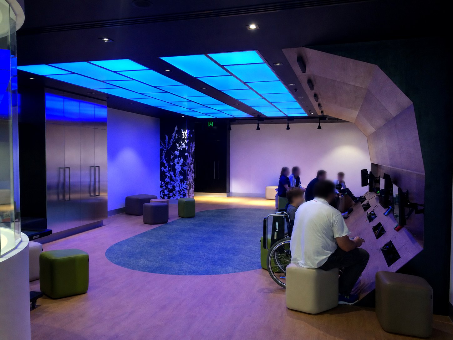 The room in its evening palette - audio stays over the stations, not the lounge