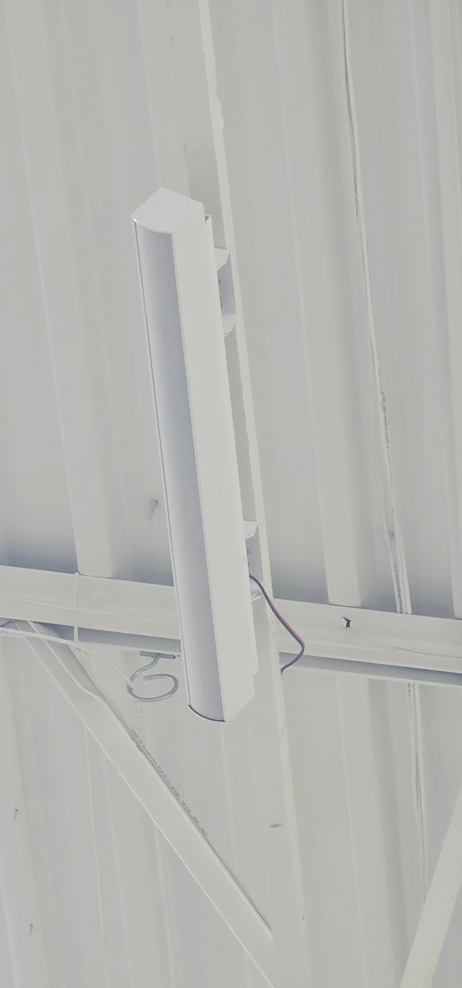 Close-up - the white column and bracket against the roof deck